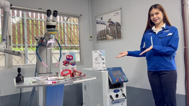 DSI staff member presenting a pulse laser welding machine in the showroom