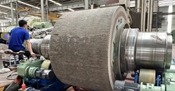 DSI technician refurbishing a large rotating shaft by Pulse Laser Welding