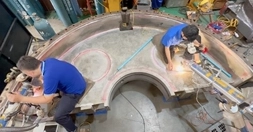 DSI technician performing Pulse Laser Welding inside a large flange bore