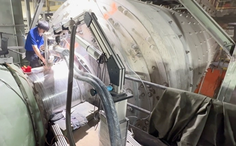 DSI technician performing Pulse Laser Mobile Welding on a cylindrical tank at a customer site