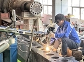DSI technician performing Pulse Laser Welding on a generator rotor
